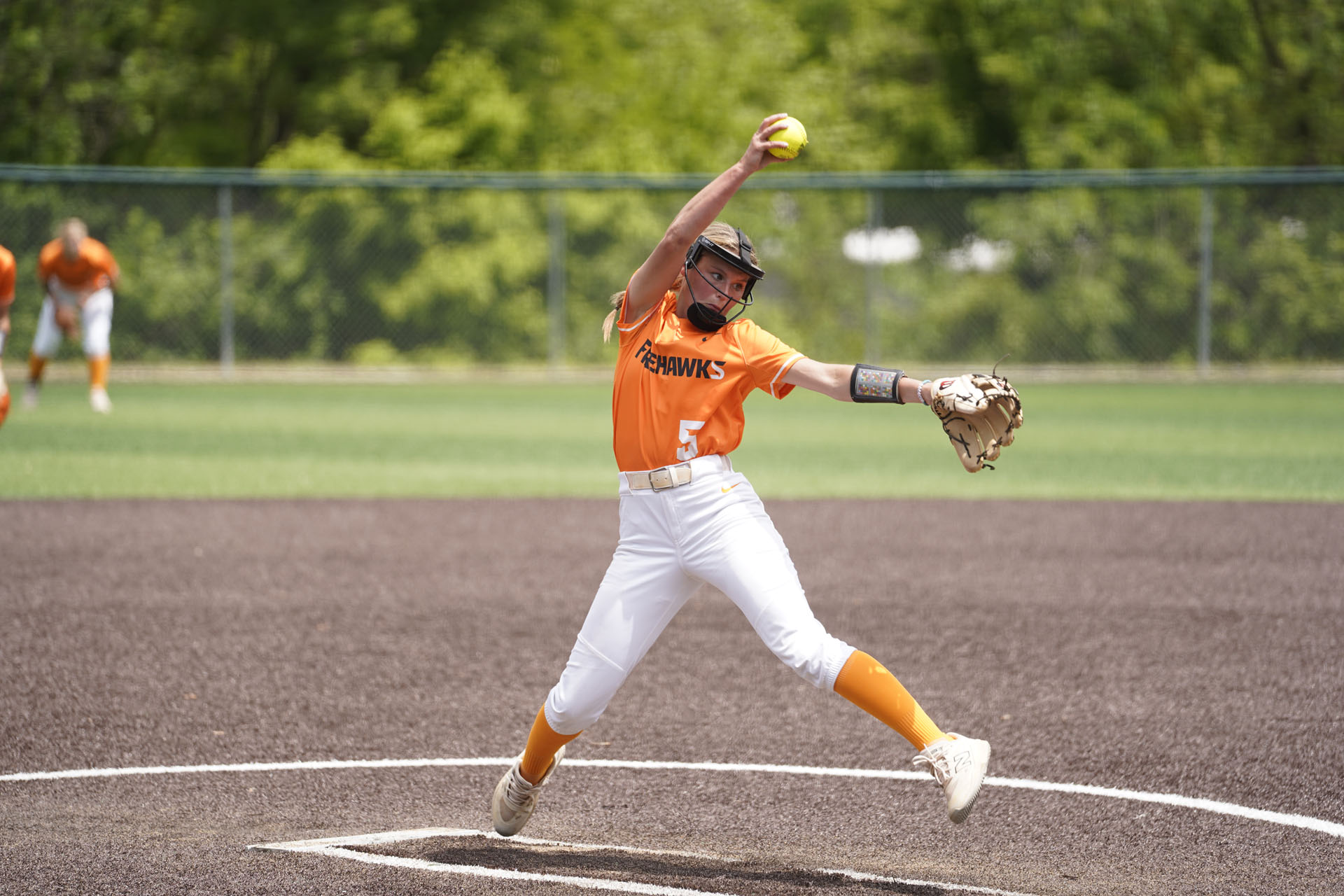 softball pitcher about to release the ball